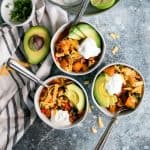 three bowls of butternut squash turkey chili with toppings