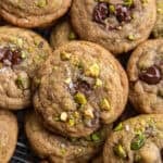 overhead view of pistachio chocolate chip cookies with flaked sea salt.