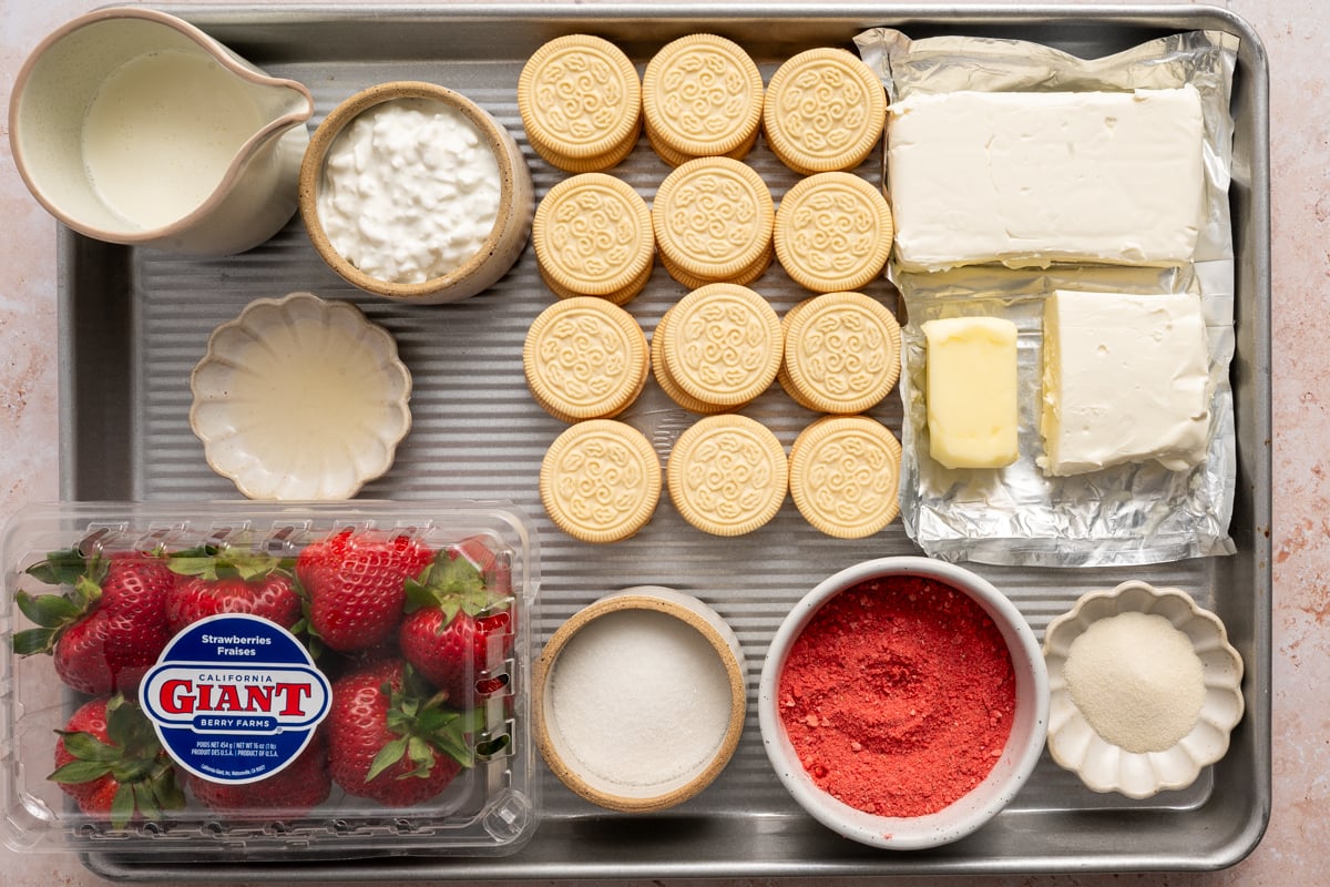 strawberry no bake cheesecake ingredients measured out on sheet pan.