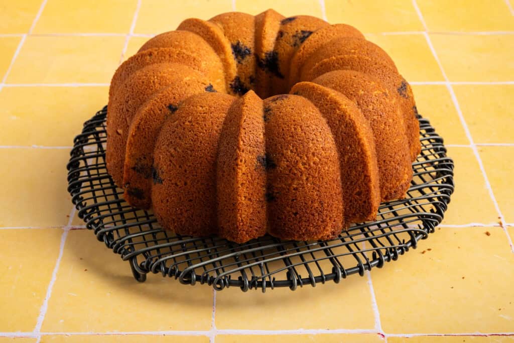 blueberry lemon bundt pan flipped out on round wire rack.
