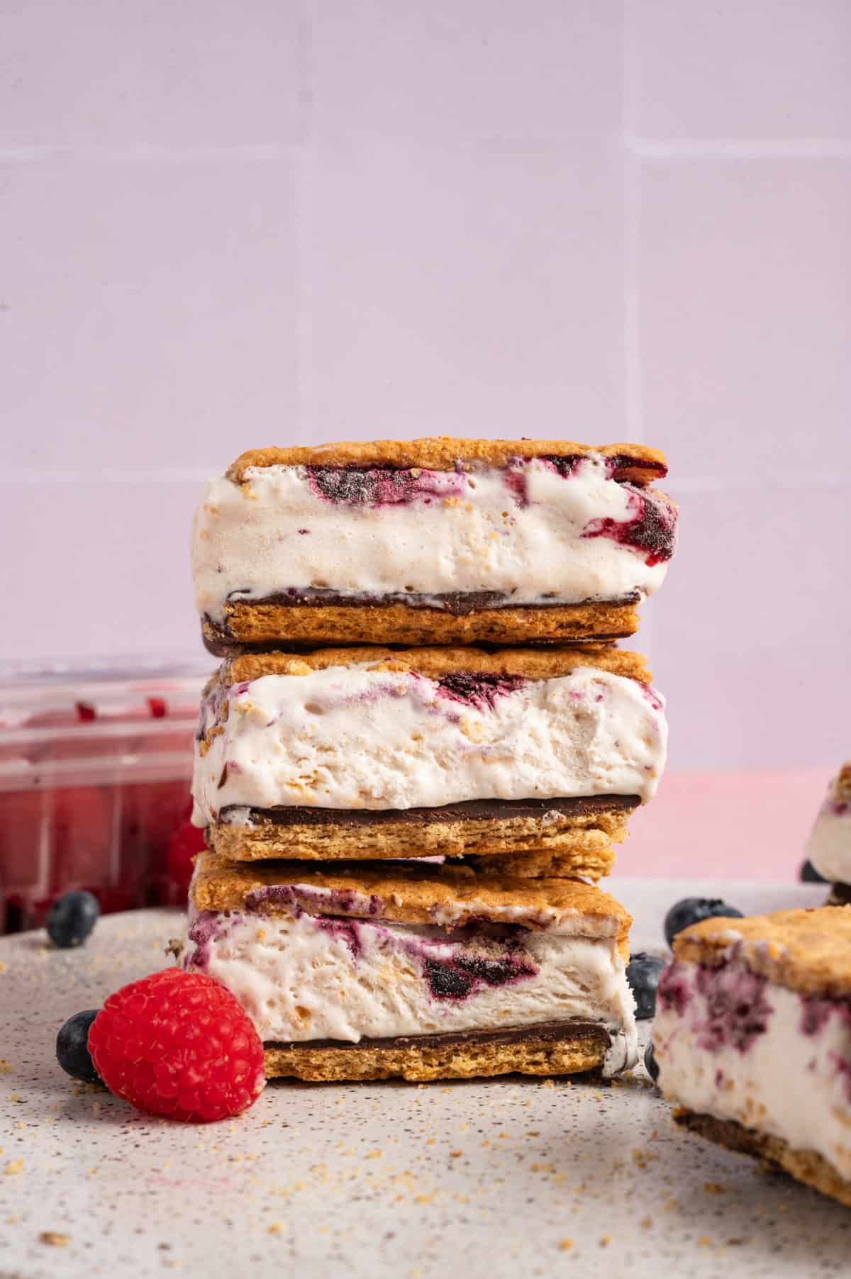 frozen s'mores stacked with berries.