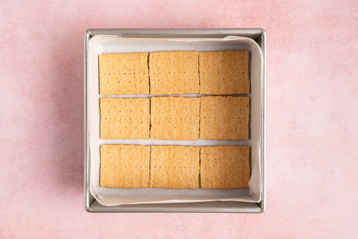 9 graham cracker squares lined in bottom of 8x8 pan.