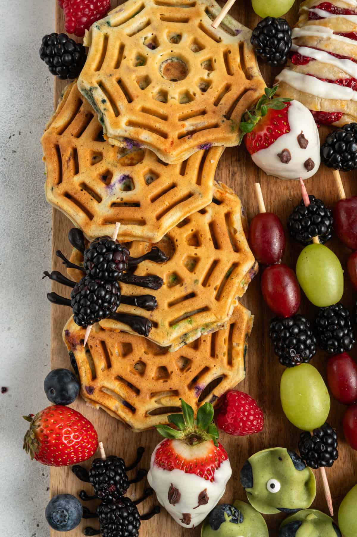 spider web waffles with blackberry spiders.